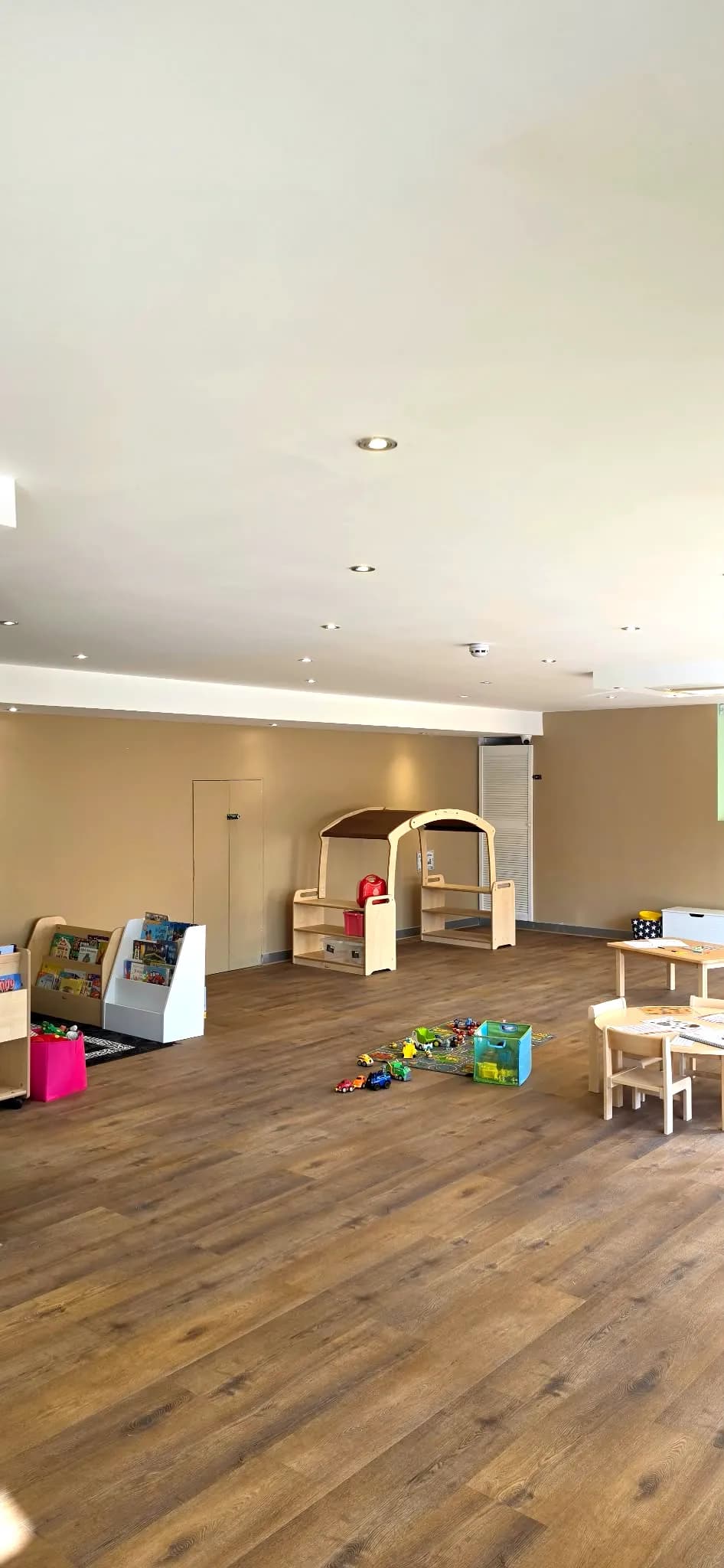 Book shelves and a wooden role-play arch